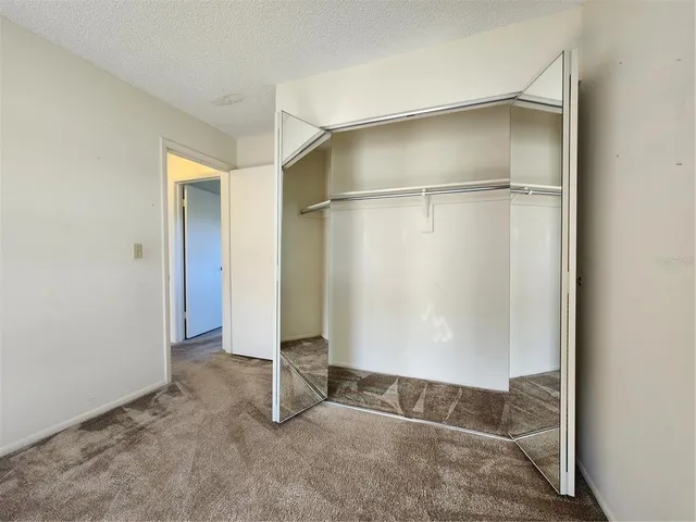 a view of a house with backyard and porch