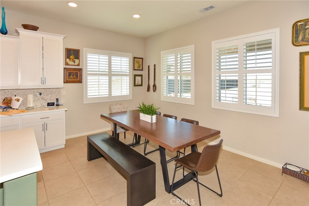 19520 Arcata Road Apple Valley, CA 92307 - Photo 11 of 53 a view of a dining room with furniture and window