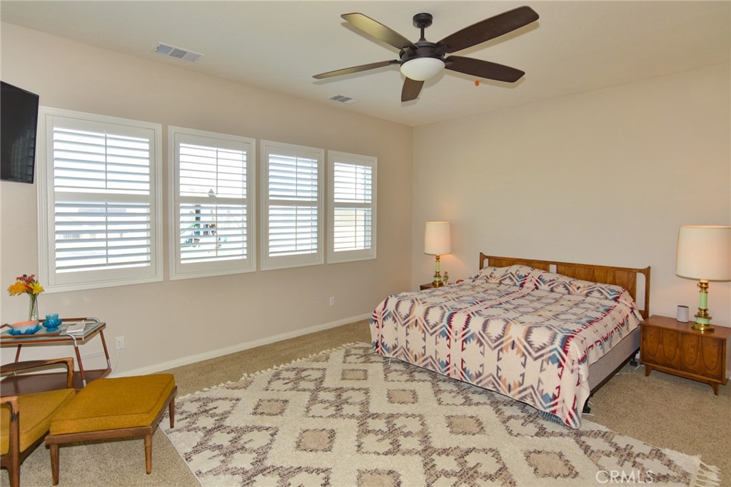 19520 Arcata Road Apple Valley, CA 92307 - Photo 18 of 53 a bedroom with a bed and a chair with the dresser