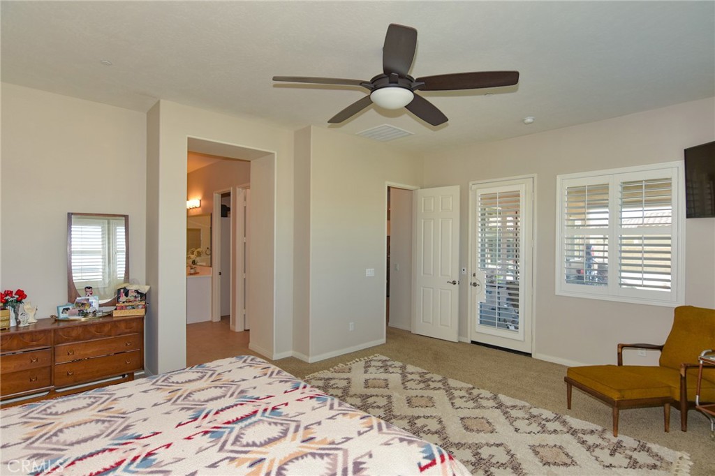 19520 Arcata Road Apple Valley, CA 92307 - Photo 19 of 53 a bedroom with a bed and wooden floor