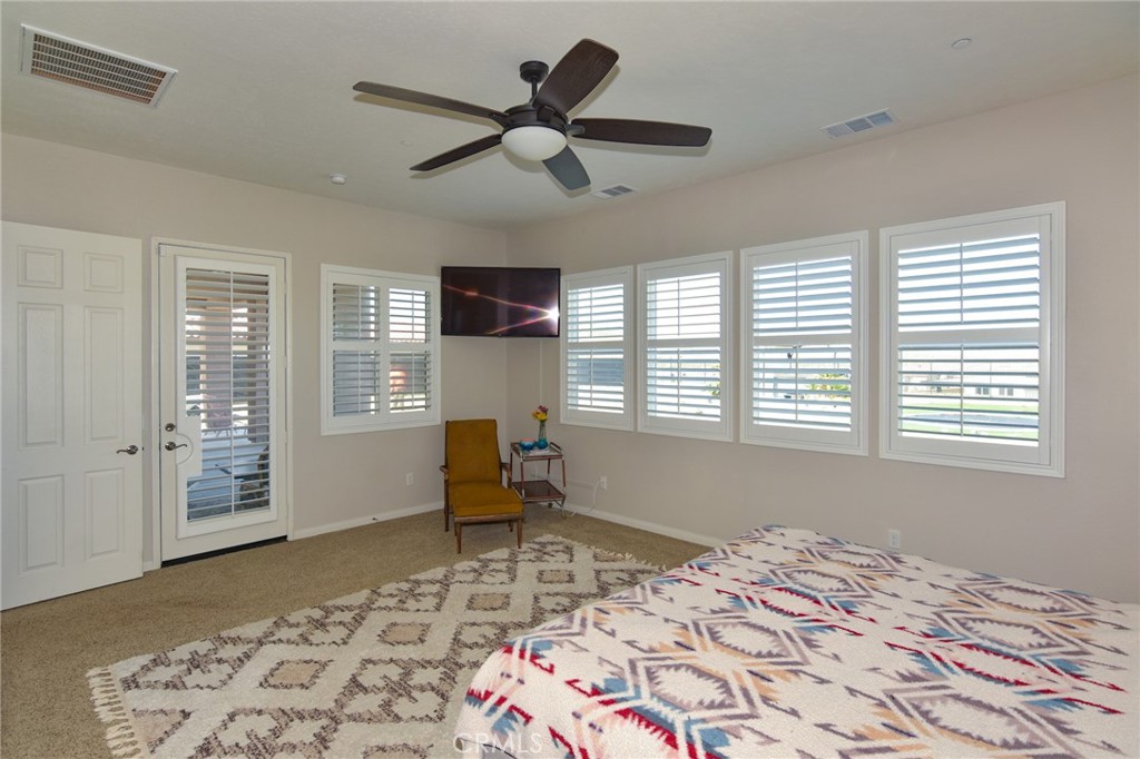 19520 Arcata Road Apple Valley, CA 92307 - Photo 20 of 53 a bedroom with a bed and wooden floor