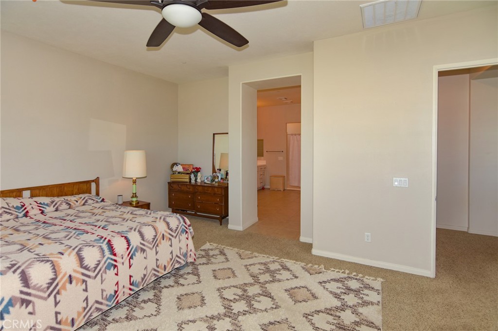 19520 Arcata Road Apple Valley, CA 92307 - Photo 21 of 53 a bedroom with a bed and wooden floor
