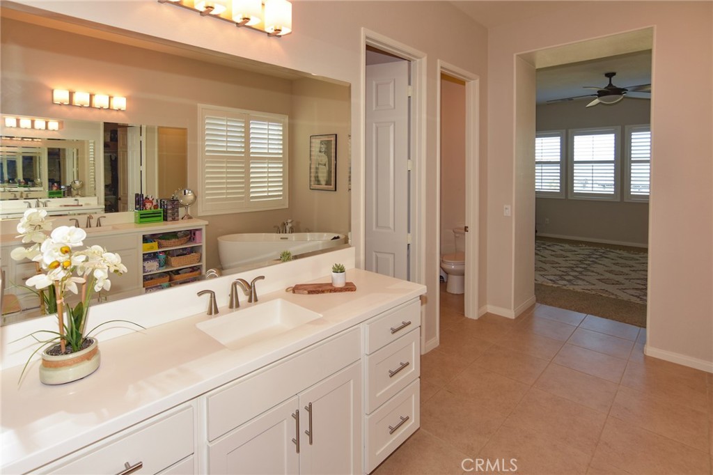 19520 Arcata Road Apple Valley, CA 92307 - Photo 23 of 53 a bathroom with a sink double vanity and a mirror