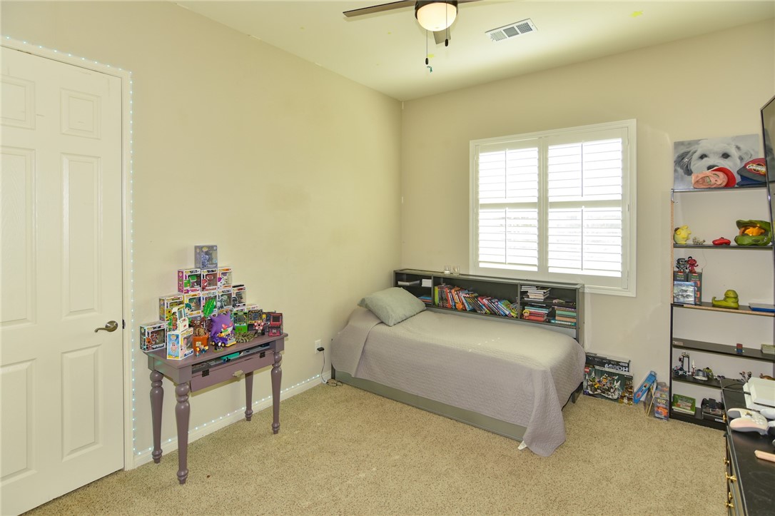 19520 Arcata Road Apple Valley, CA 92307 - Photo 27 of 53 a bedroom with furniture and a bed