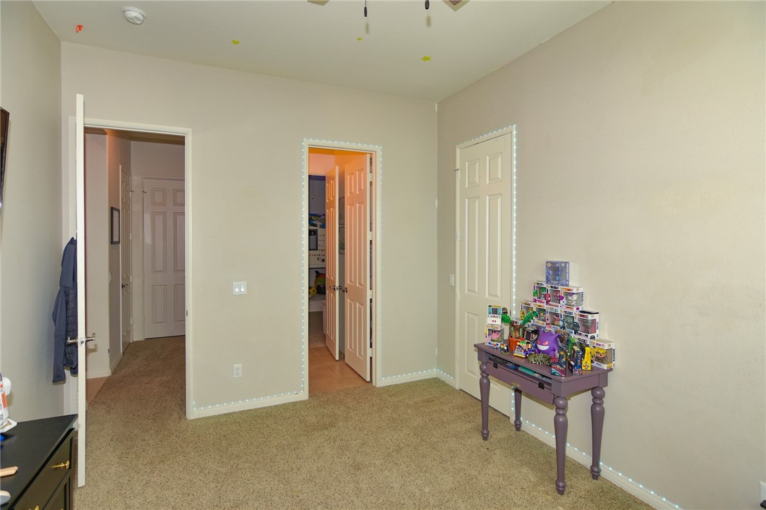 19520 Arcata Road Apple Valley, CA 92307 - Photo 28 of 53 a living room with furniture and flowers