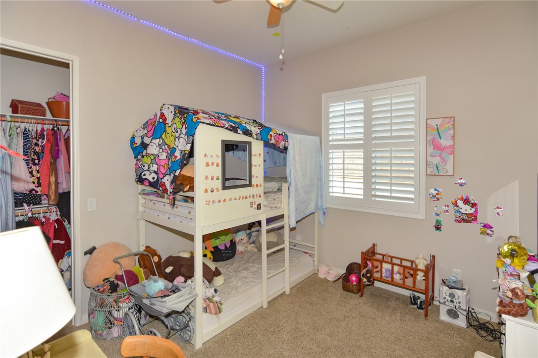 19520 Arcata Road Apple Valley, CA 92307 - Photo 29 of 53 a living room with furniture toys and a window