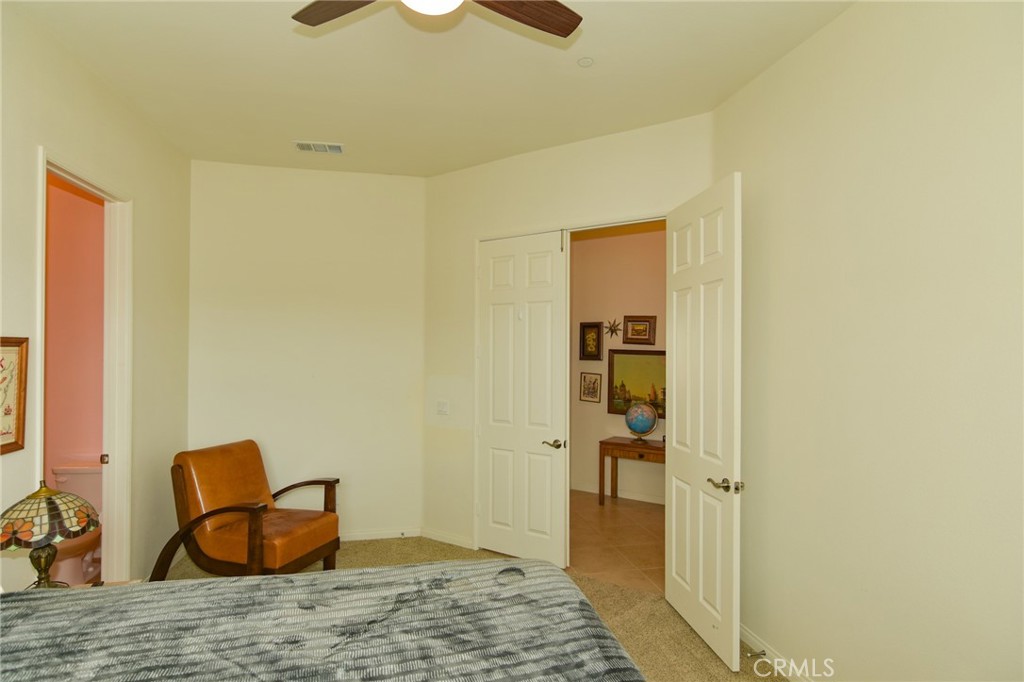19520 Arcata Road Apple Valley, CA 92307 - Photo 34 of 53 a bedroom with a bed and wooden floor