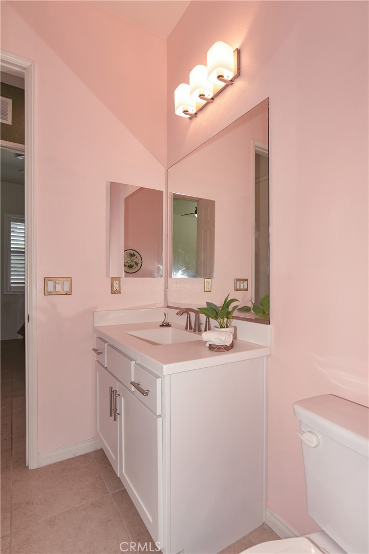 19520 Arcata Road Apple Valley, CA 92307 - Photo 35 of 53 a bathroom with a sink a vanity and a mirror