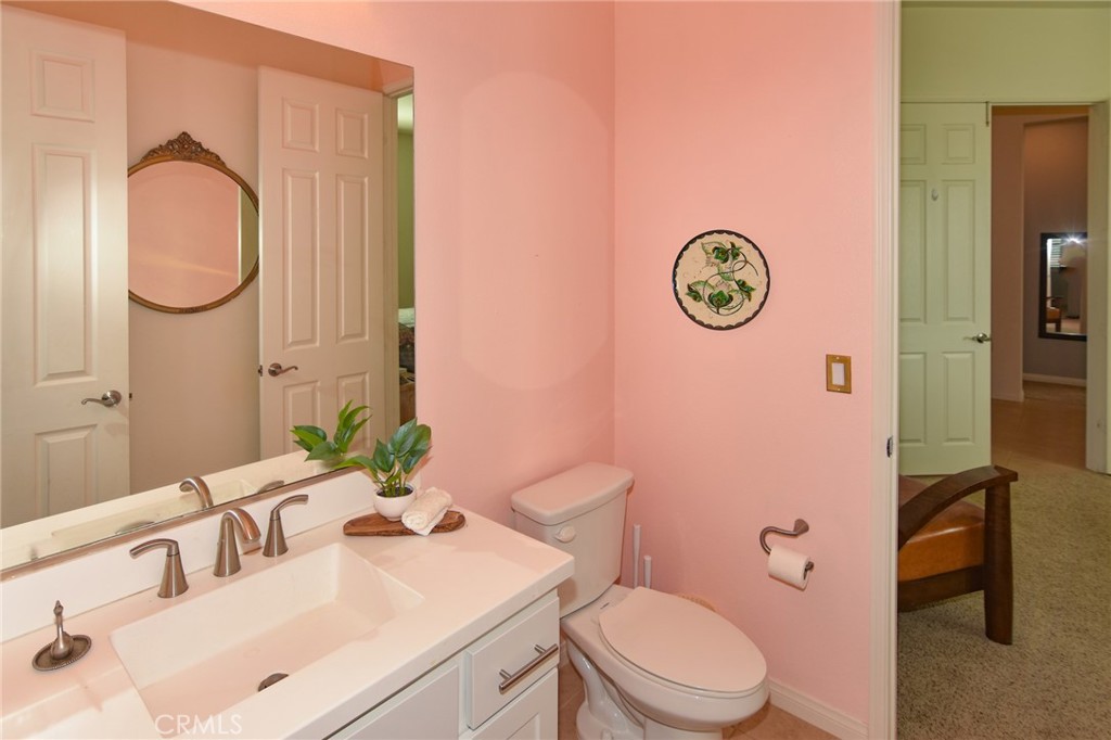 19520 Arcata Road Apple Valley, CA 92307 - Photo 36 of 53 a bathroom with a sink vanity mirror and toilet