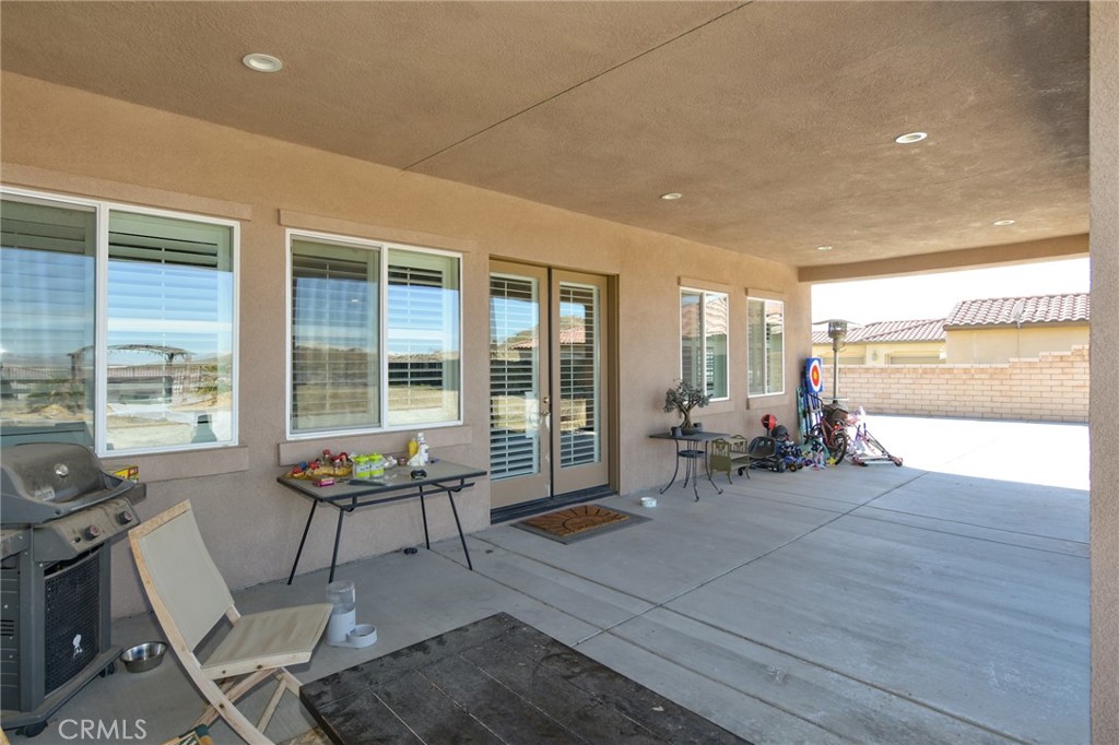 19520 Arcata Road Apple Valley, CA 92307 - Photo 45 of 53 a living room with furniture and large windows