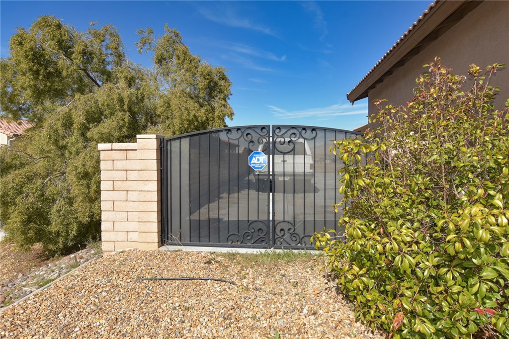 19520 Arcata Road Apple Valley, CA 92307 - Photo 47 of 53 a view of entrance gate of the house and tree