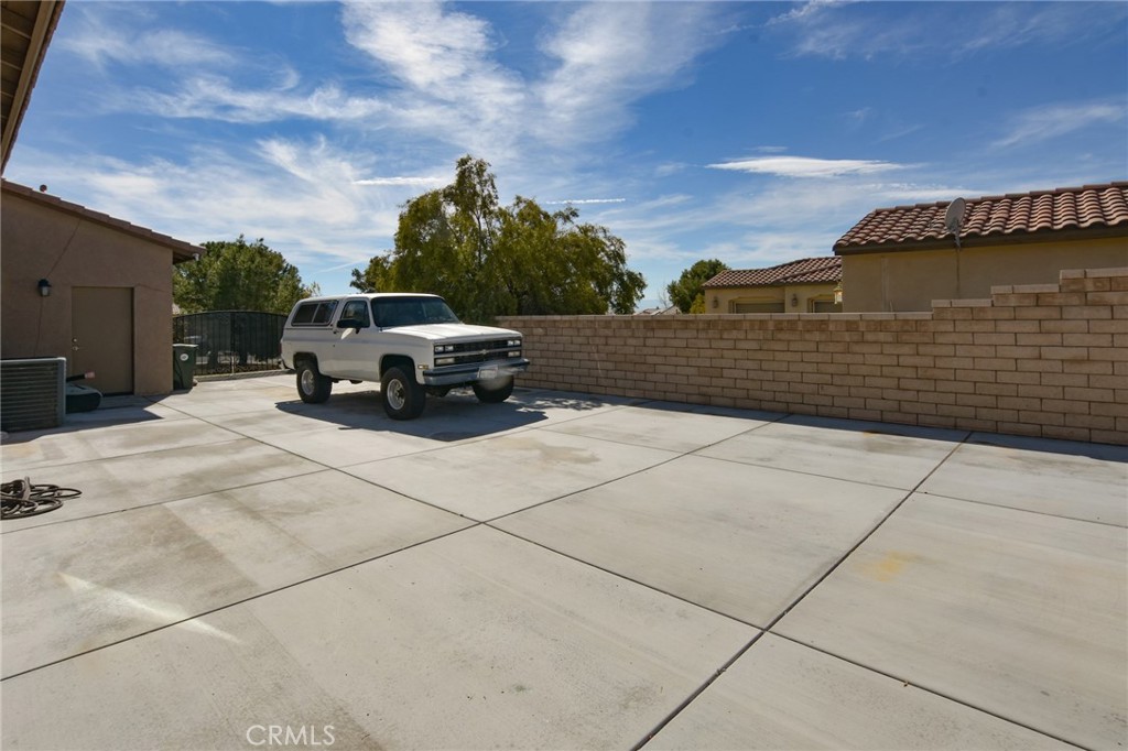 19520 Arcata Road Apple Valley, CA 92307 - Photo 48 of 53 a car parked on the side of a building
