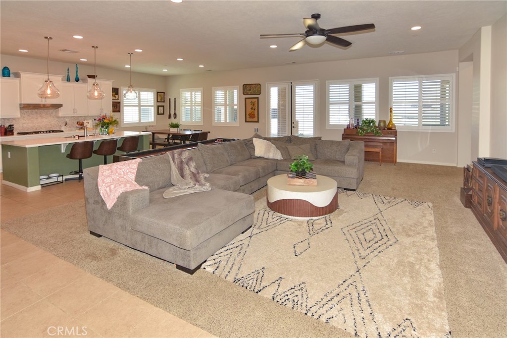 19520 Arcata Road Apple Valley, CA 92307 - Photo 7 of 53 a living room with kitchen island furniture and a view of kitchen