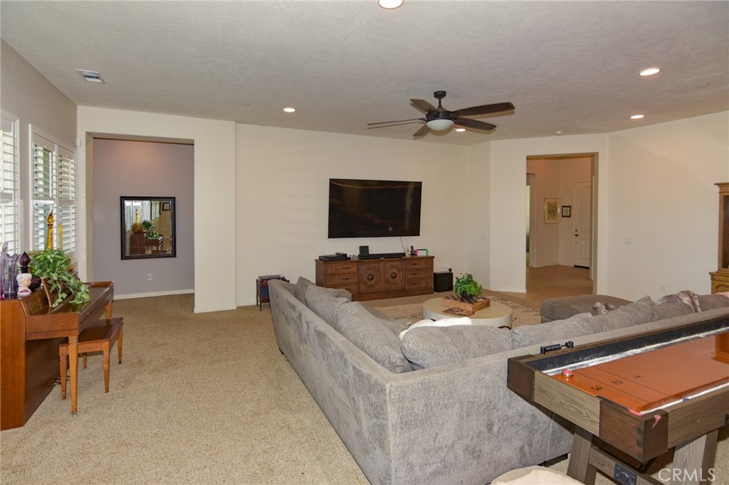 19520 Arcata Road Apple Valley, CA 92307 - Photo 9 of 53 a living room with furniture and a flat screen tv
