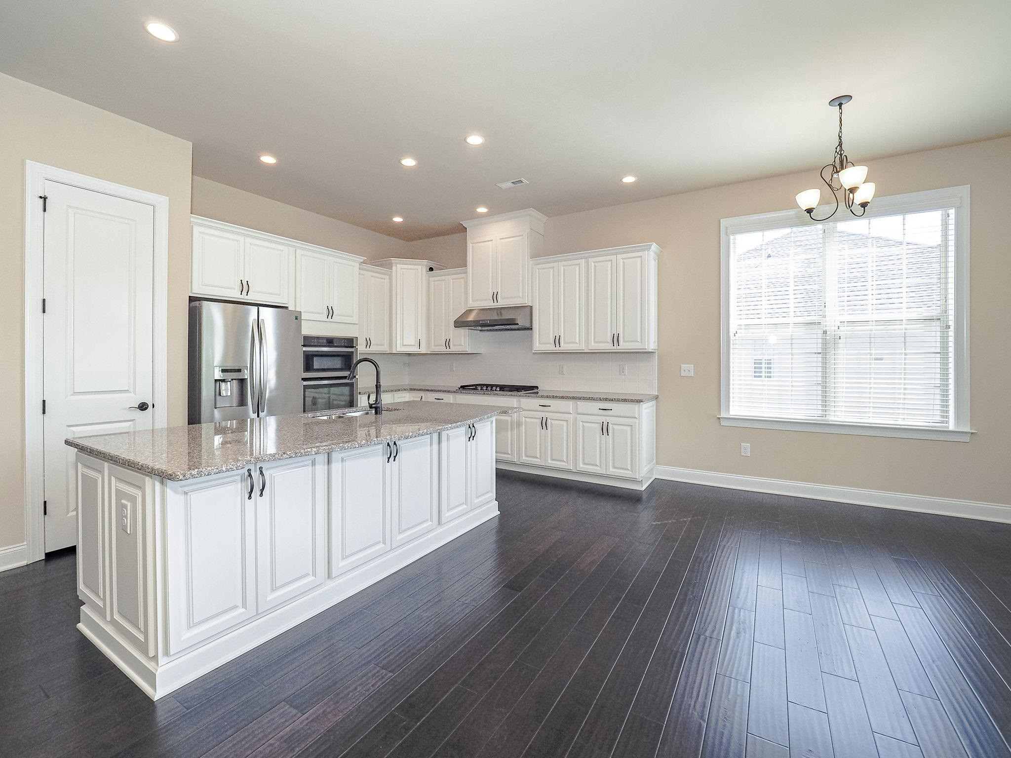2619 Beckwith Road Apex, NC 27523 - Photo 12 of 46 Nice sized pantry, granite countertops, SS appliances, nice sized island with storage all around. Gas range, double ovens and a refrigerator to convey. This is too good to be true. Kitchen