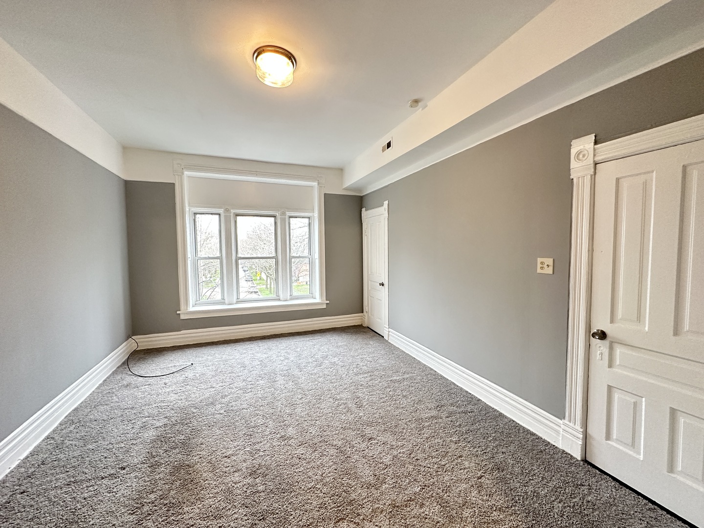 2730 West 16th Street Chicago, IL 60608 - Photo 13 of 14 a view of an empty room with a window