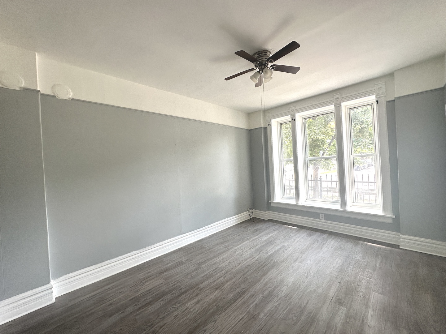 2730 West 16th Street Chicago, IL 60608 - Photo 3 of 14 a view of a big room with wooden floor and windows
