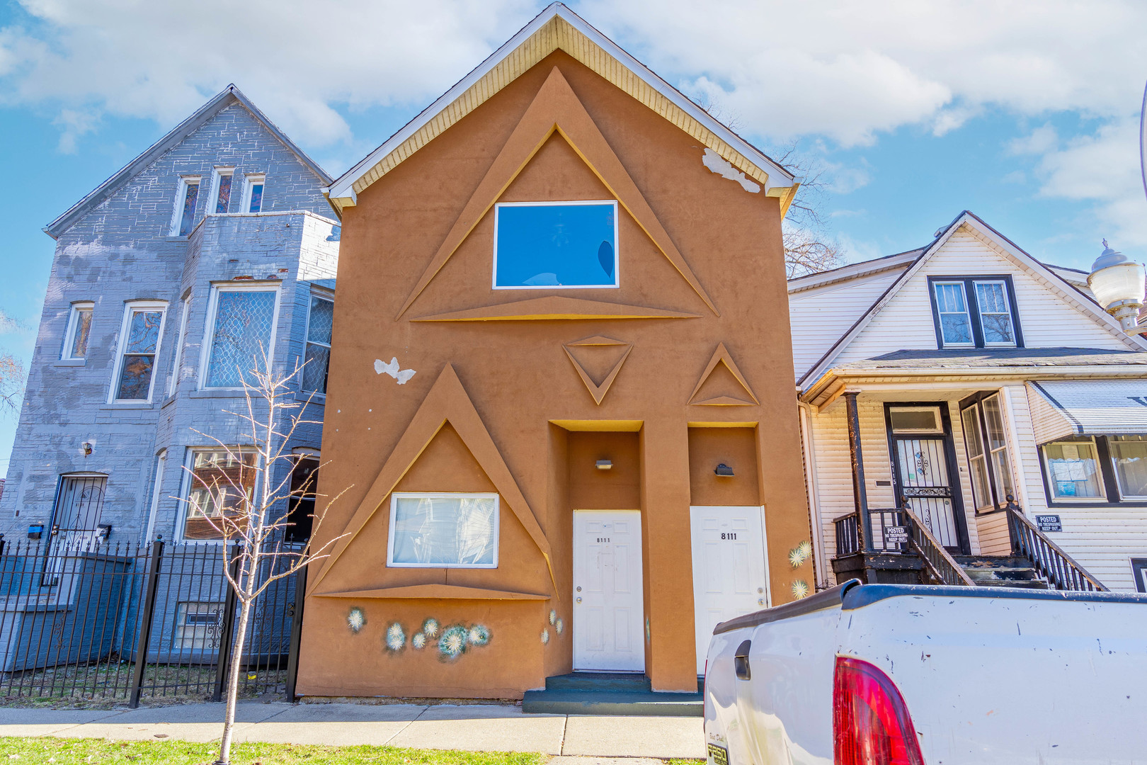 a front view of a house with a yard
