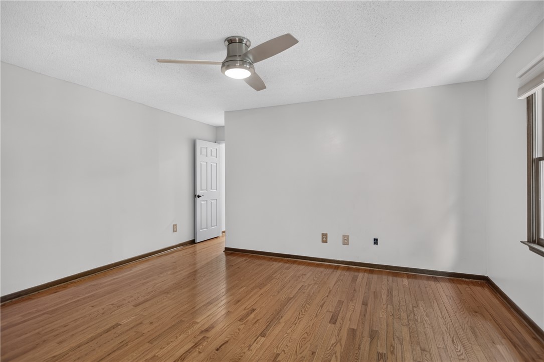 103 Dorsey Lane Walhalla, SC 29691 - Photo 16 of 42 Hardwood floors and a sleek ceiling fan define this inviting, naturally lit bedroom space.