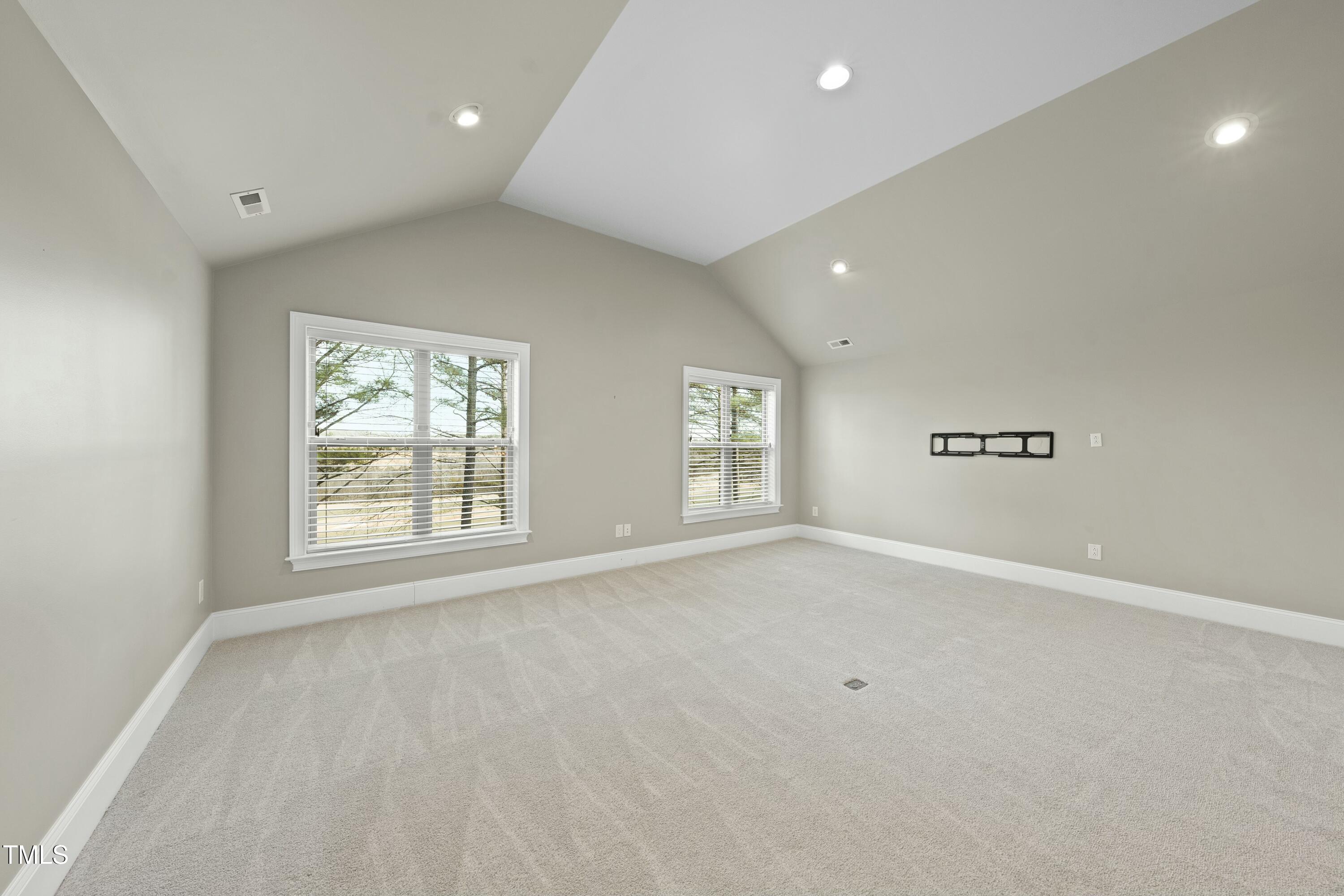 7220 Hasentree Way Wake Forest, NC 27587 - Photo 19 of 39 an empty room with windows