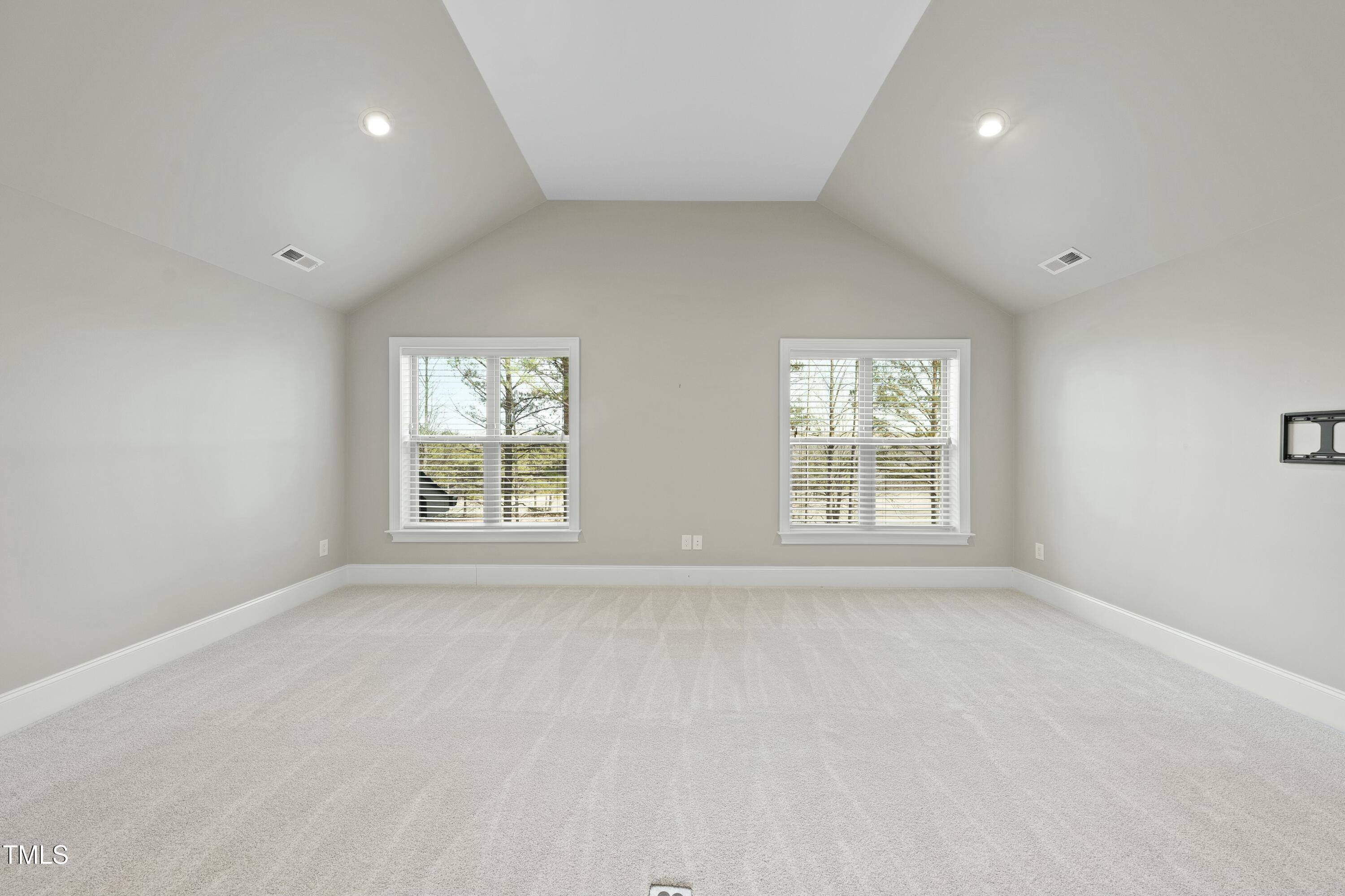 7220 Hasentree Way Wake Forest, NC 27587 - Photo 20 of 39 a view of an empty room with a window