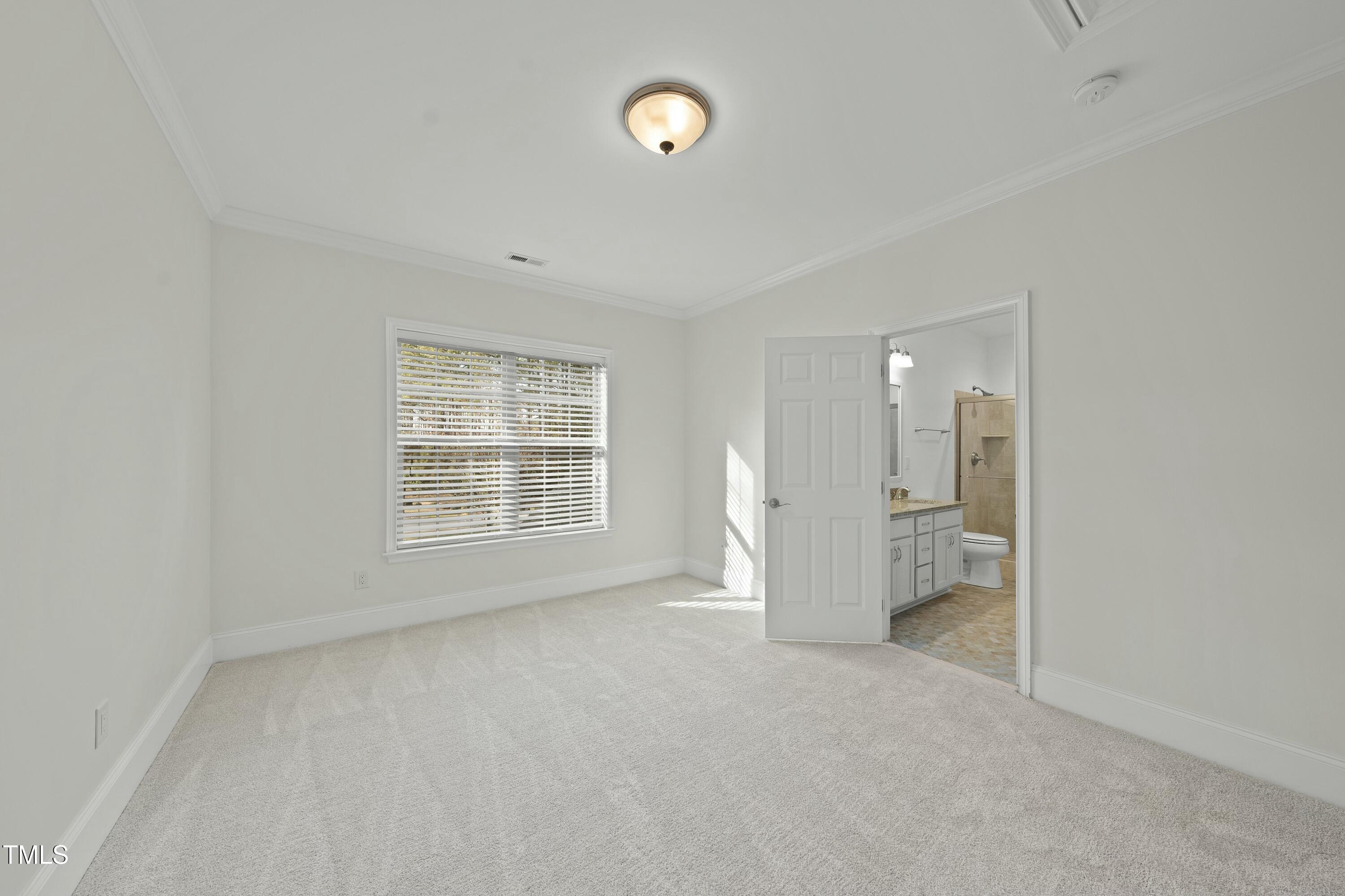 7220 Hasentree Way Wake Forest, NC 27587 - Photo 21 of 39 a view of an empty room with a window