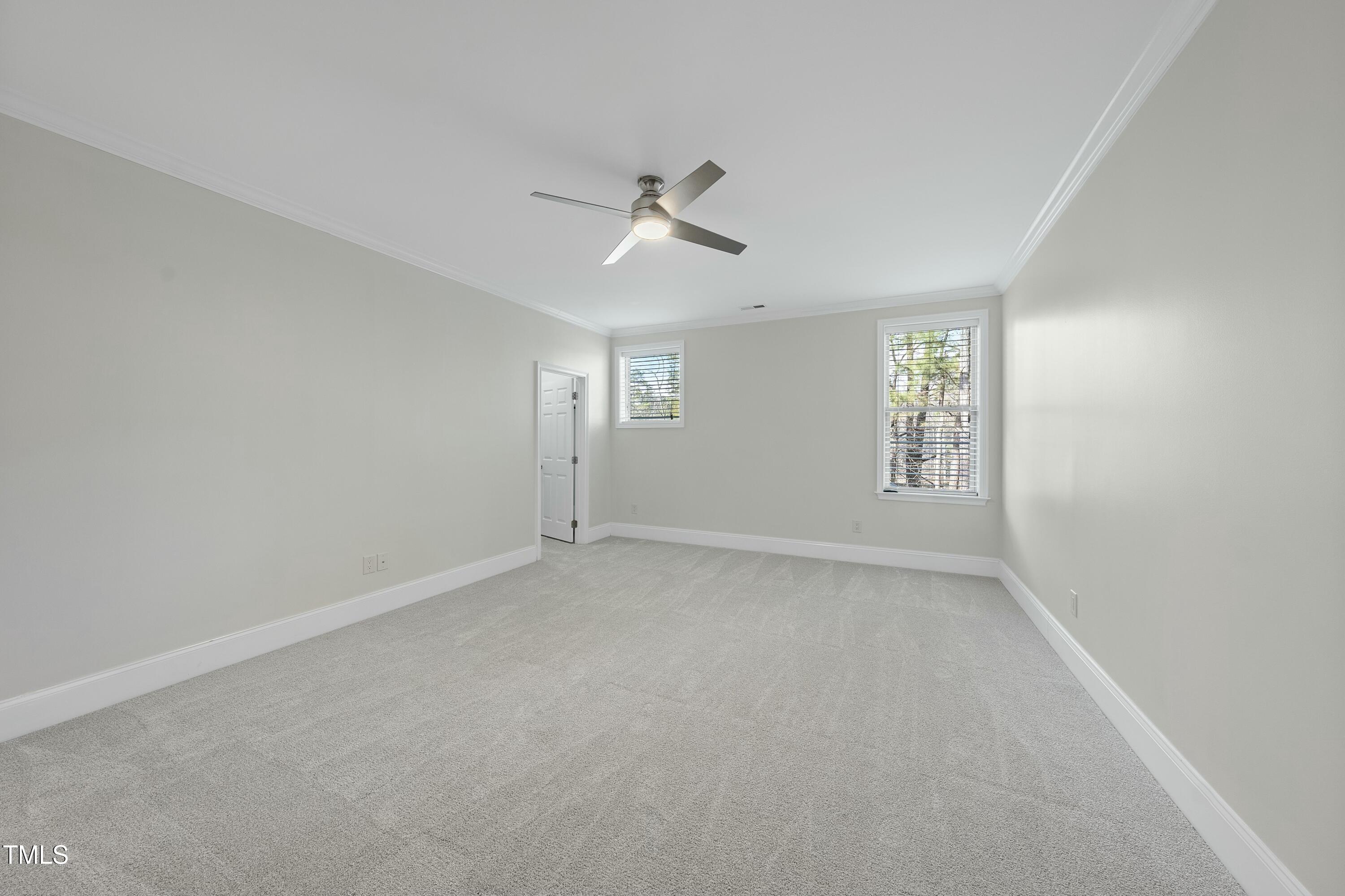 7220 Hasentree Way Wake Forest, NC 27587 - Photo 25 of 39 an empty room with windows and fan