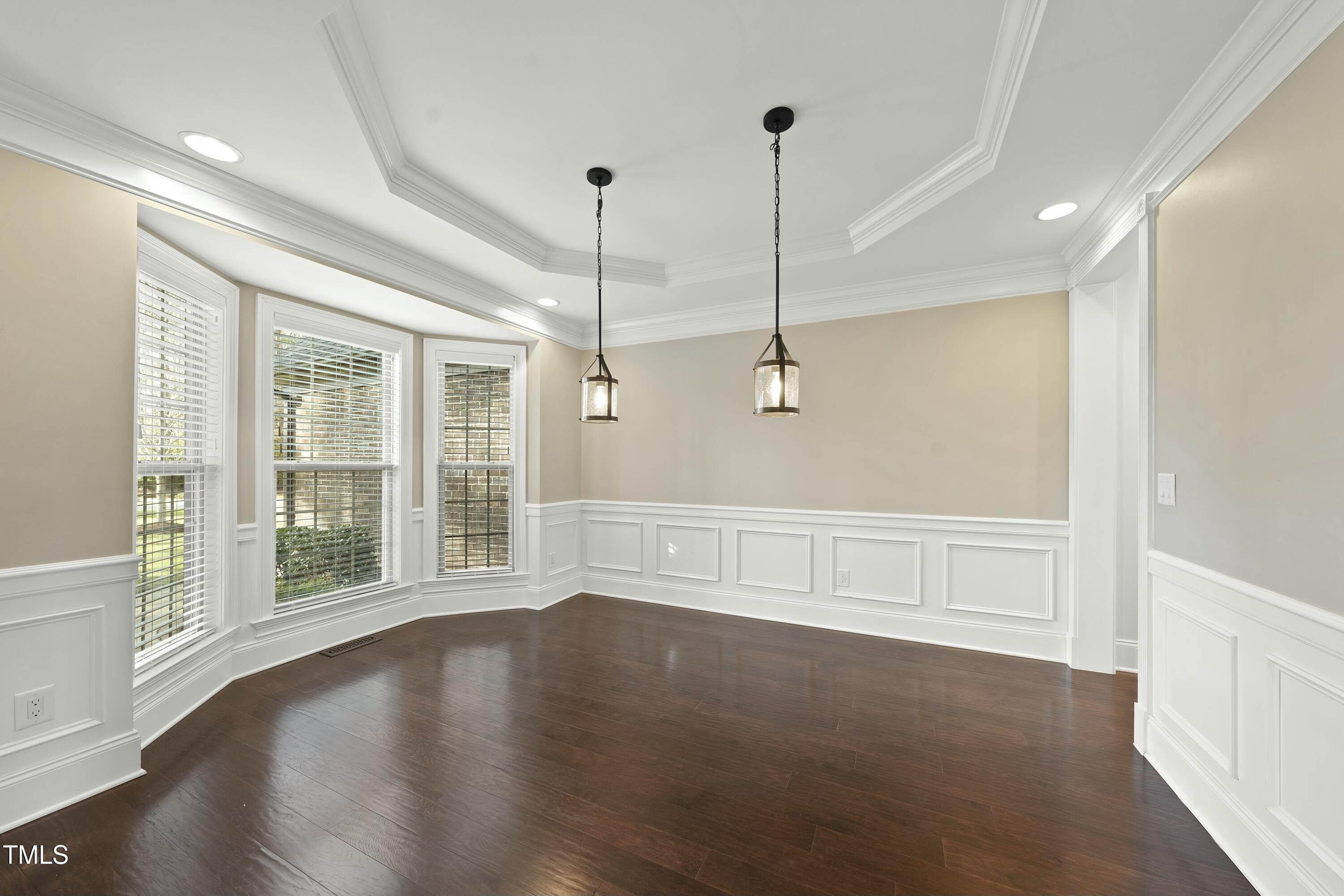 7220 Hasentree Way Wake Forest, NC 27587 - Photo 7 of 39 a view of an empty room with wooden floor and a window