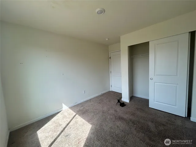 an empty room with sliding door