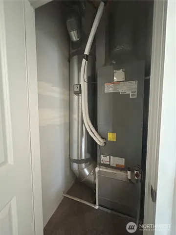 a room with wooden floor and white wall