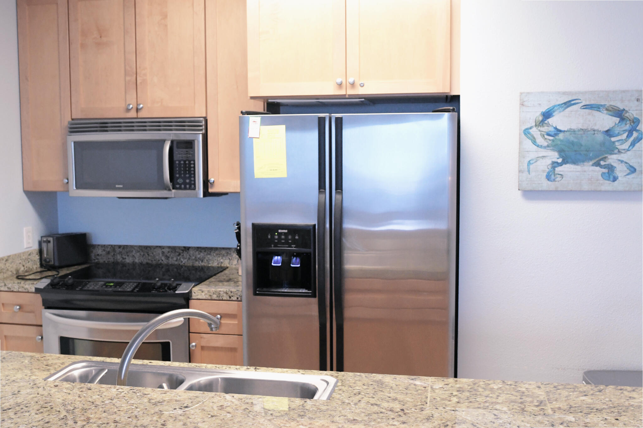 43 Cassine Way, Unit 202 Santa Rosa Beach, FL 32459 - Photo 13 of 25 a kitchen with a refrigerator and a stove top oven