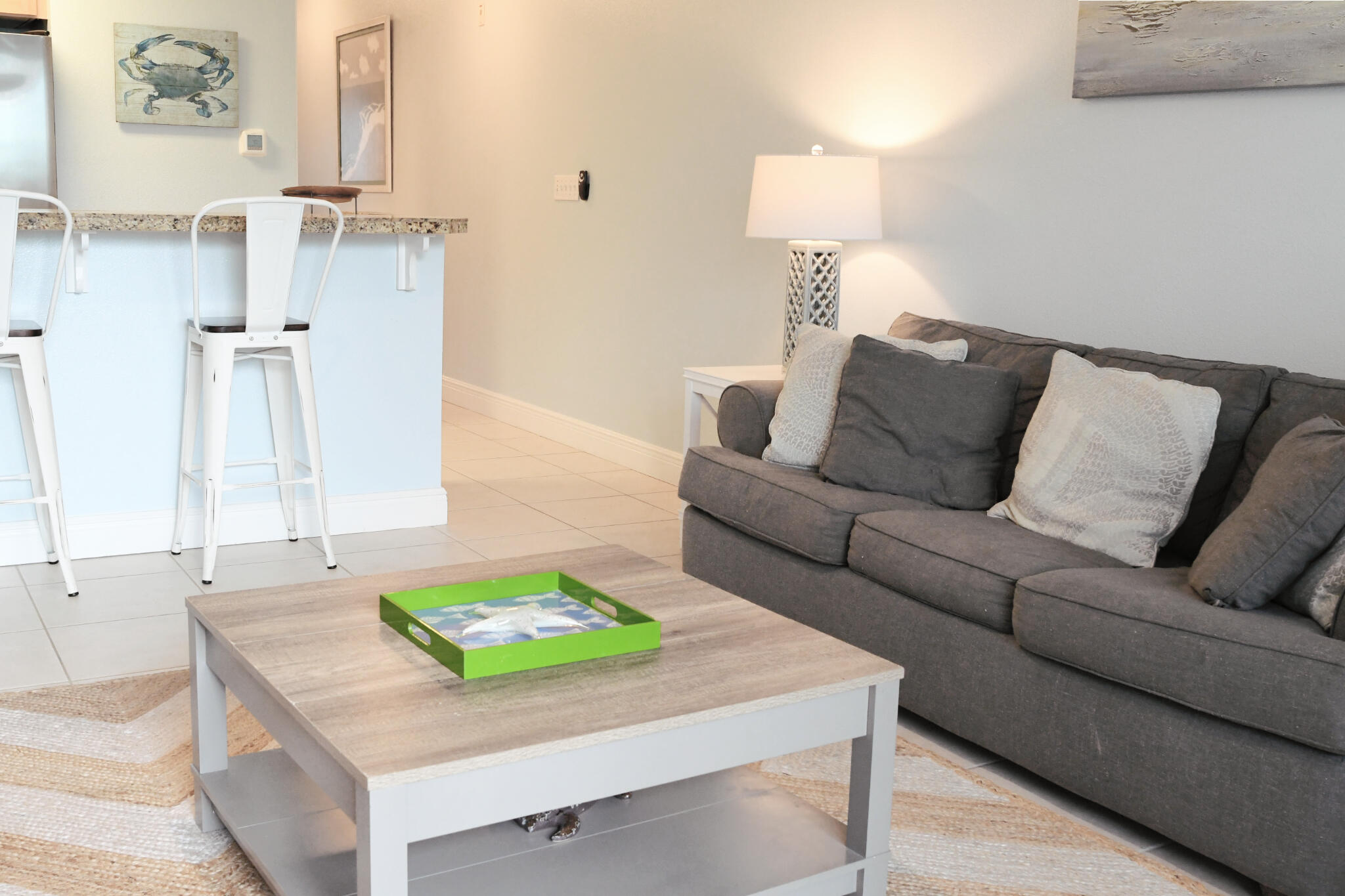 43 Cassine Way, Unit 202 Santa Rosa Beach, FL 32459 - Photo 17 of 25 a living room with a couch and a table