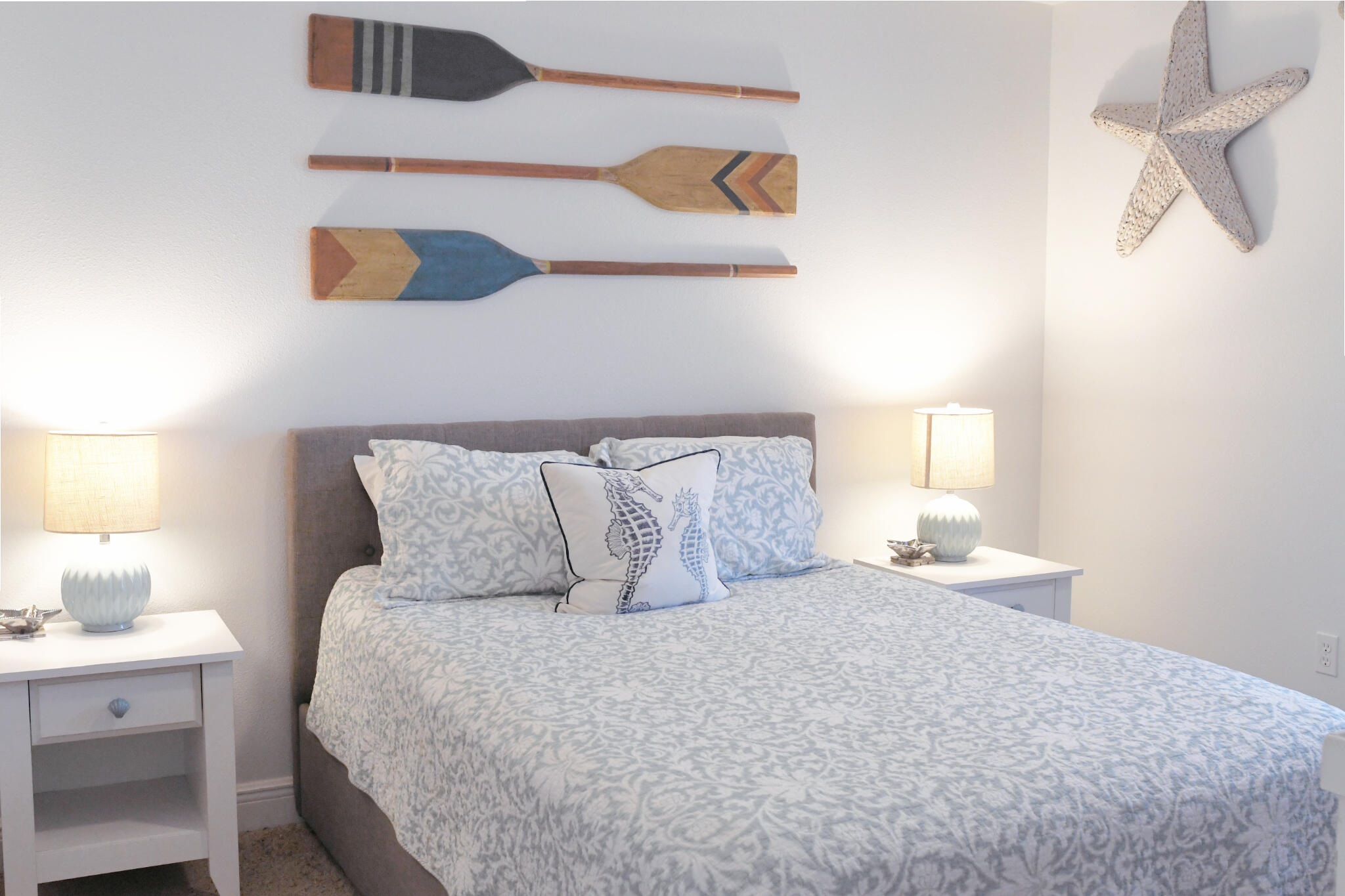 43 Cassine Way, Unit 202 Santa Rosa Beach, FL 32459 - Photo 4 of 25 a bedroom with a bed and lamps