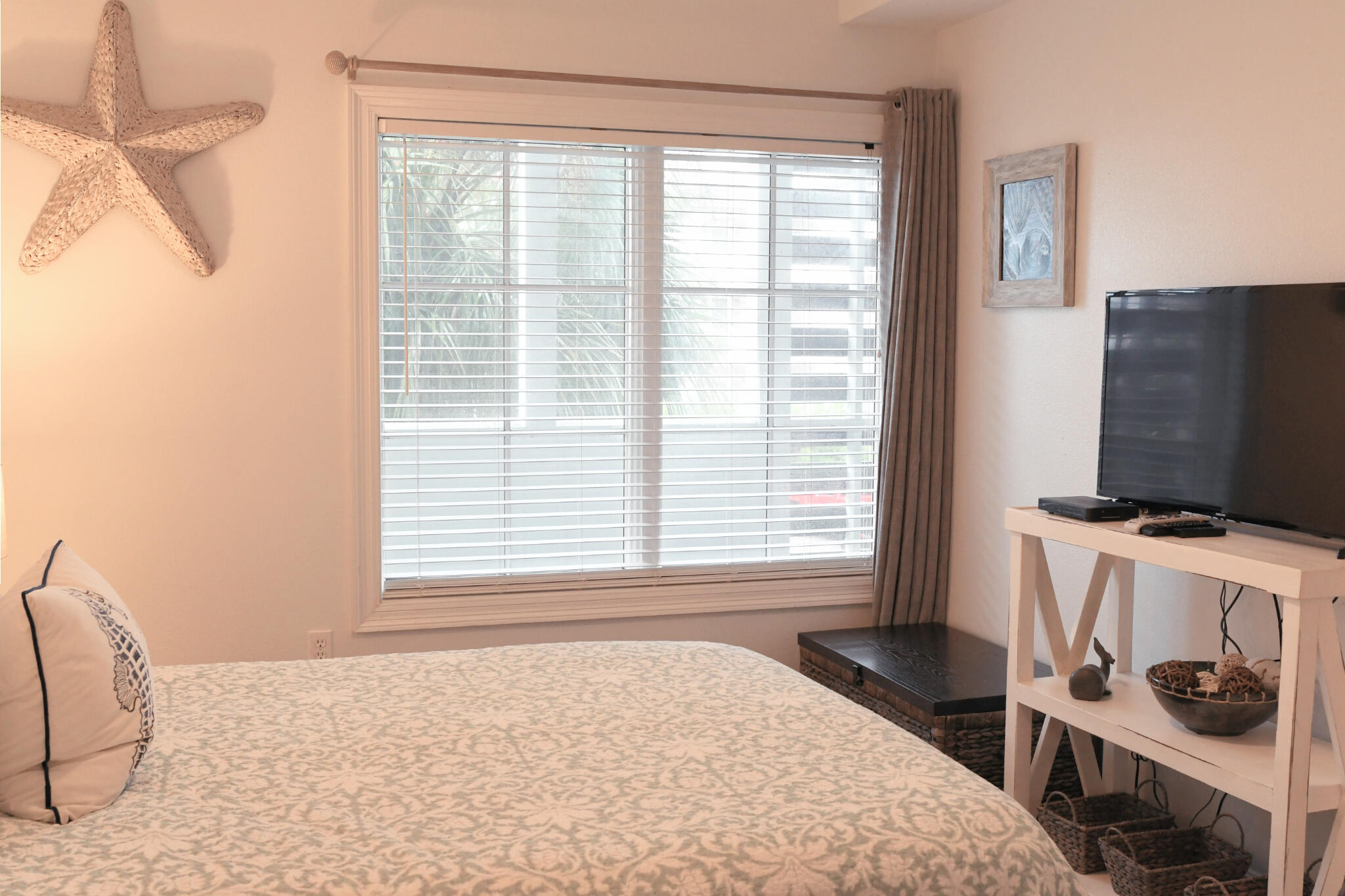 43 Cassine Way, Unit 202 Santa Rosa Beach, FL 32459 - Photo 5 of 25 a bedroom with a bed and a flat screen tv