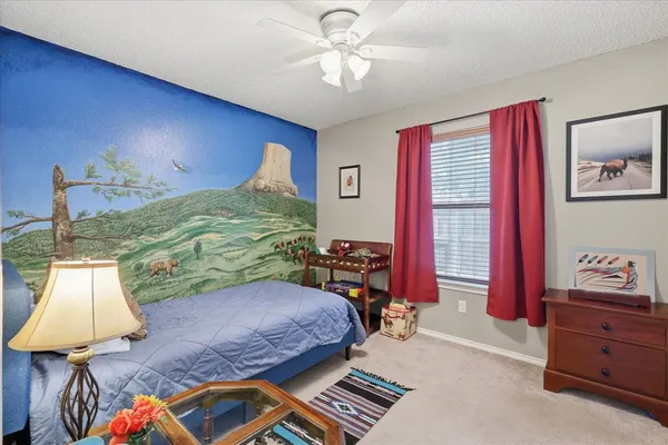 a bed room with a bed and a window