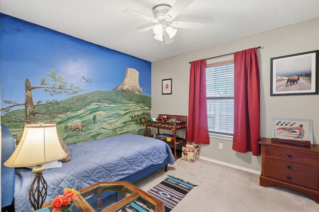 2532 Winding Road Fort Worth, TX 76133 - Photo 12 of 21 a bed room with a bed and a window