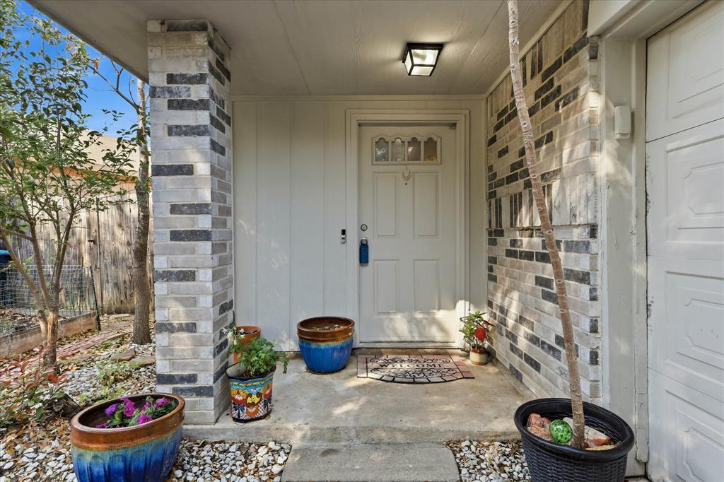 2532 Winding Road Fort Worth, TX 76133 - Photo 2 of 21 a bathroom with a toilet and a shower curtain