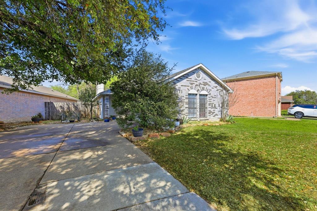 2532 Winding Road Fort Worth, TX 76133 - Photo 21 of 21 a front view of a house with garden