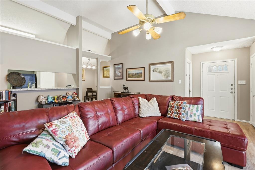 2532 Winding Road Fort Worth, TX 76133 - Photo 5 of 21 a living room with a couch and chandelier