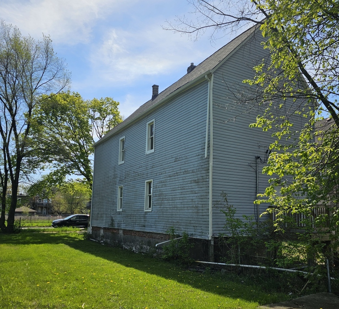 6004 South Aberdeen Street Chicago, IL 60621 - Photo 16 of 17 a backyard of a house with lots of green space
