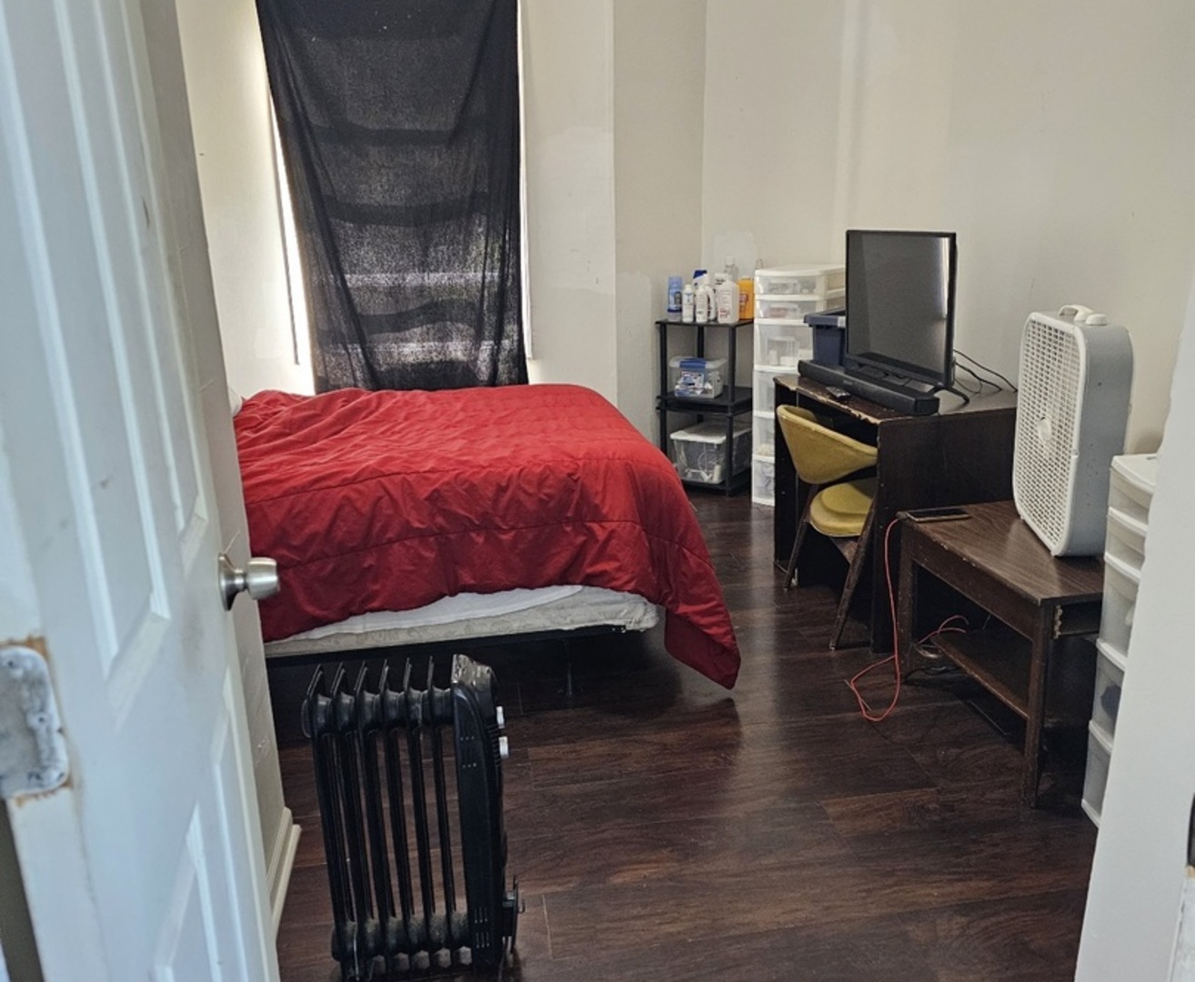 6004 South Aberdeen Street Chicago, IL 60621 - Photo 4 of 17 a bed room with a bed and a chair