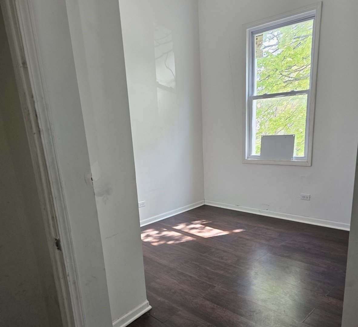 6004 South Aberdeen Street Chicago, IL 60621 - Photo 5 of 17 a view of an empty room and window