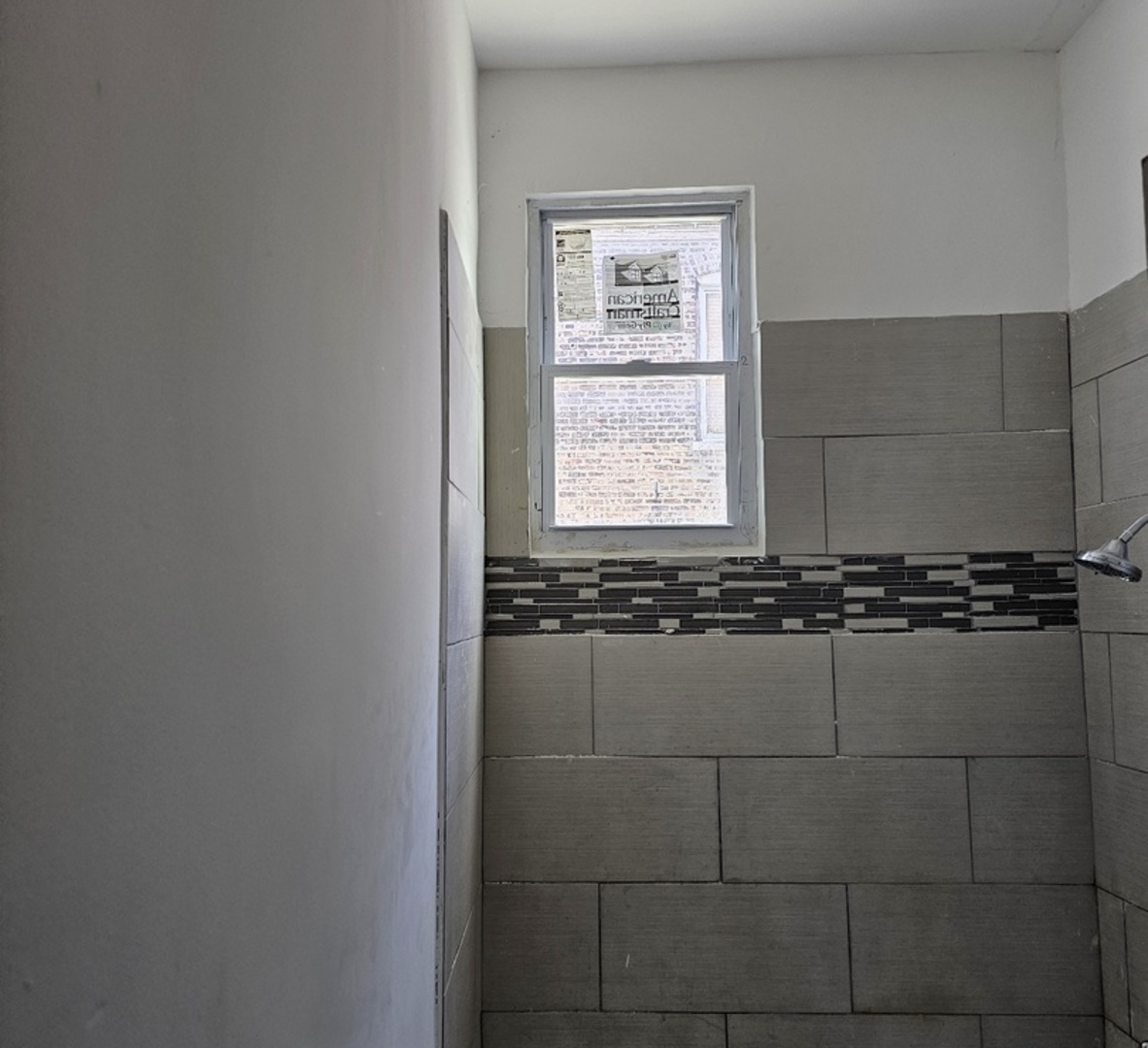 6004 South Aberdeen Street Chicago, IL 60621 - Photo 8 of 17 a bathroom with a shower and a sink