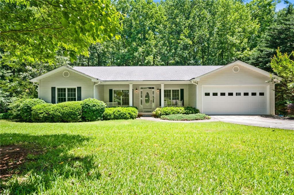 1294 Red Rock Road Northwest Acworth, GA 30101 - Photo 1 of 1 a front view of a house with a yard and garage