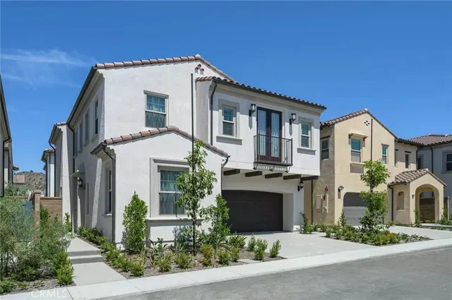 a front view of a house with yard