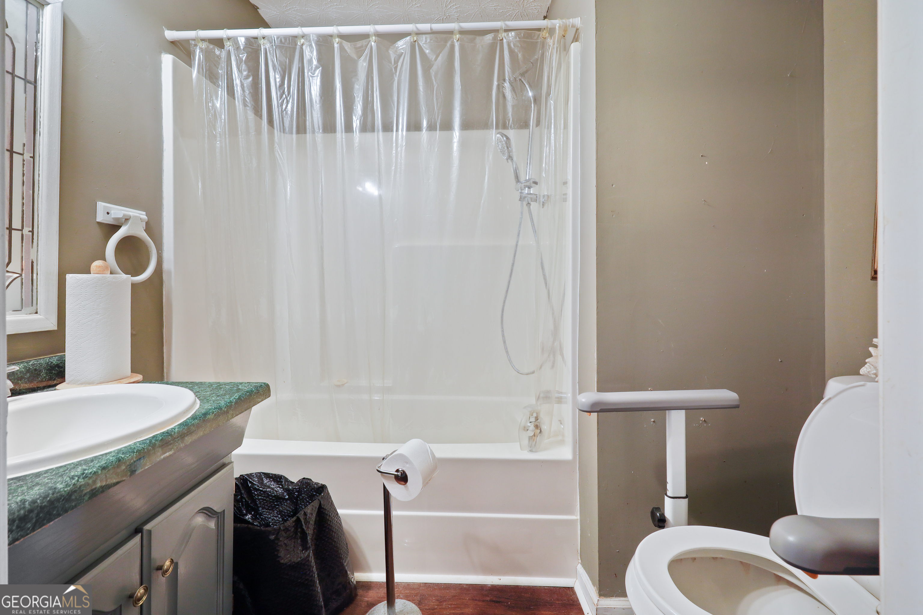 2433 Bear Creek Road Statham, GA 30666 - Photo 17 of 58 a bathroom with a sink toilet and shower