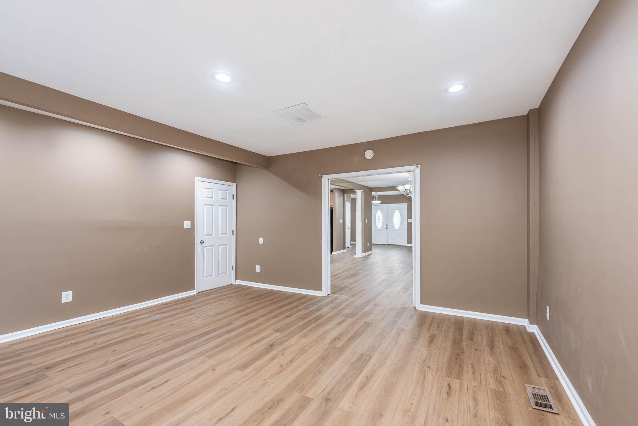 4021 Barrington Road Baltimore, MD 21207 - Photo 13 of 50 a view of livingroom with wooden floor