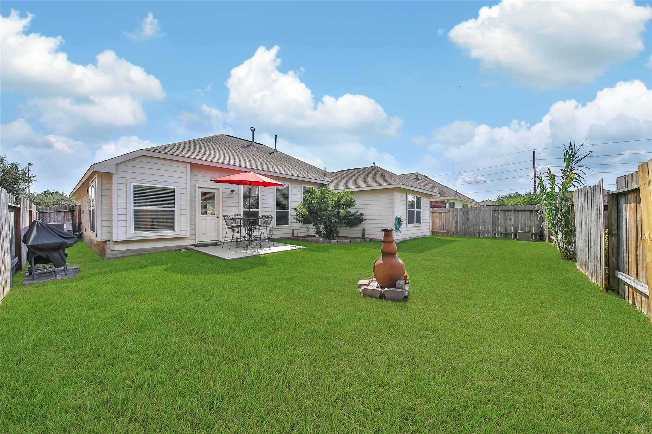 23411 Sawmill Pass Spring, TX 77373 - Photo 18 of 20 a front view of a house with garden