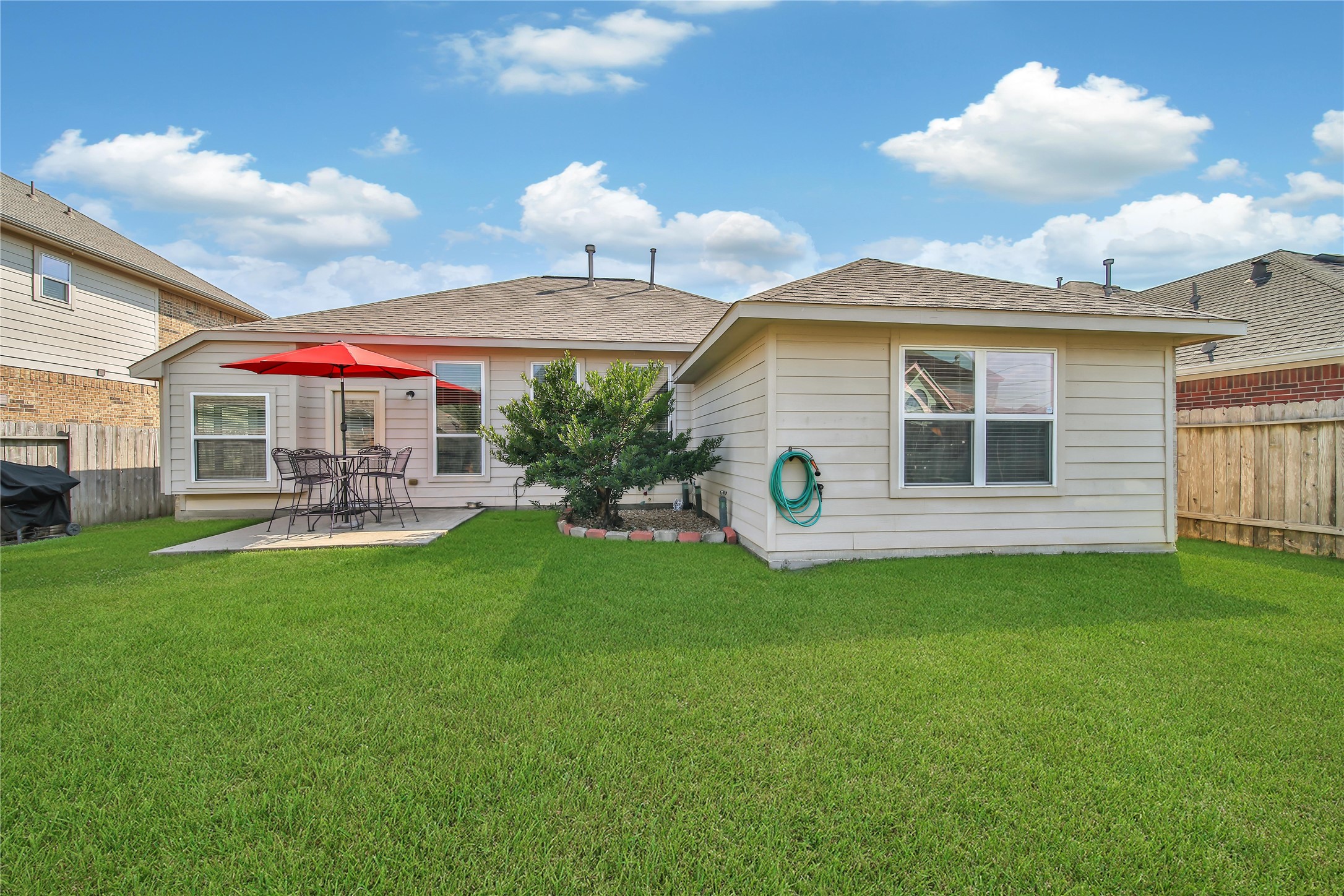 23411 Sawmill Pass Spring, TX 77373 - Photo 19 of 20 a front view of house with yard barbeque oven and lots of green space