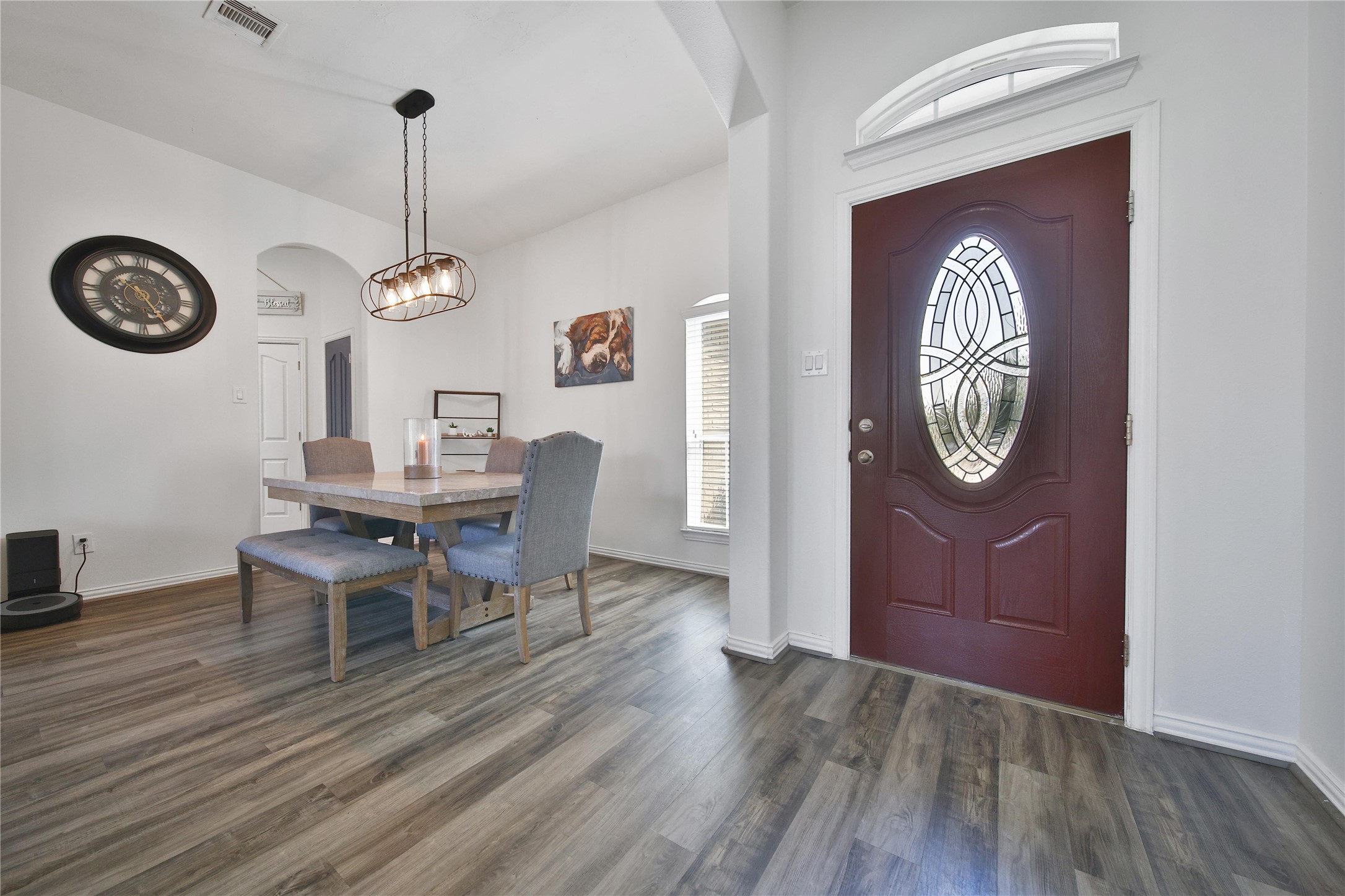 23411 Sawmill Pass Spring, TX 77373 - Photo 3 of 20 a view of a dining room with furniture a chandelier and wooden floor